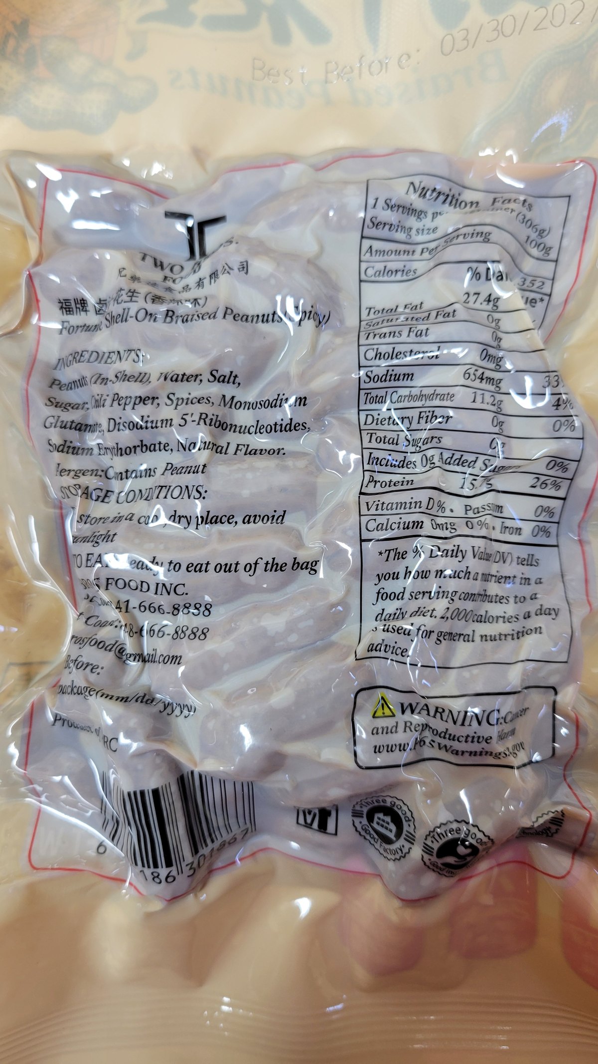 The back of the spicy bag: "Fortune Shell-On Braised Peanuts (Spicy)", with chili pepper listed in the ingredients and the nutrition panel that gives 654 mg of sodium per 100 g