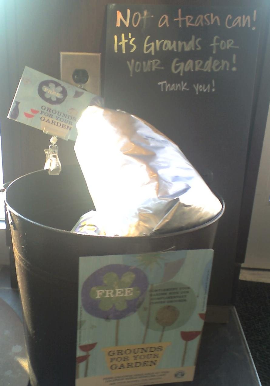 Some cafés have worked this out and just hand the grounds over. "Not a trash can! It's Grounds for your Garden!"