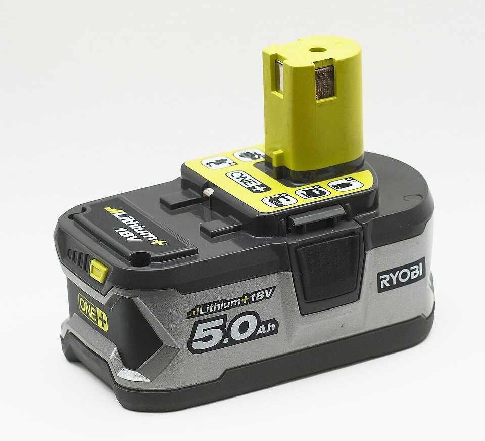 A Ryobi 18-volt lithium battery pack marked 5.0 Ah, grey and black with a yellow-green stem