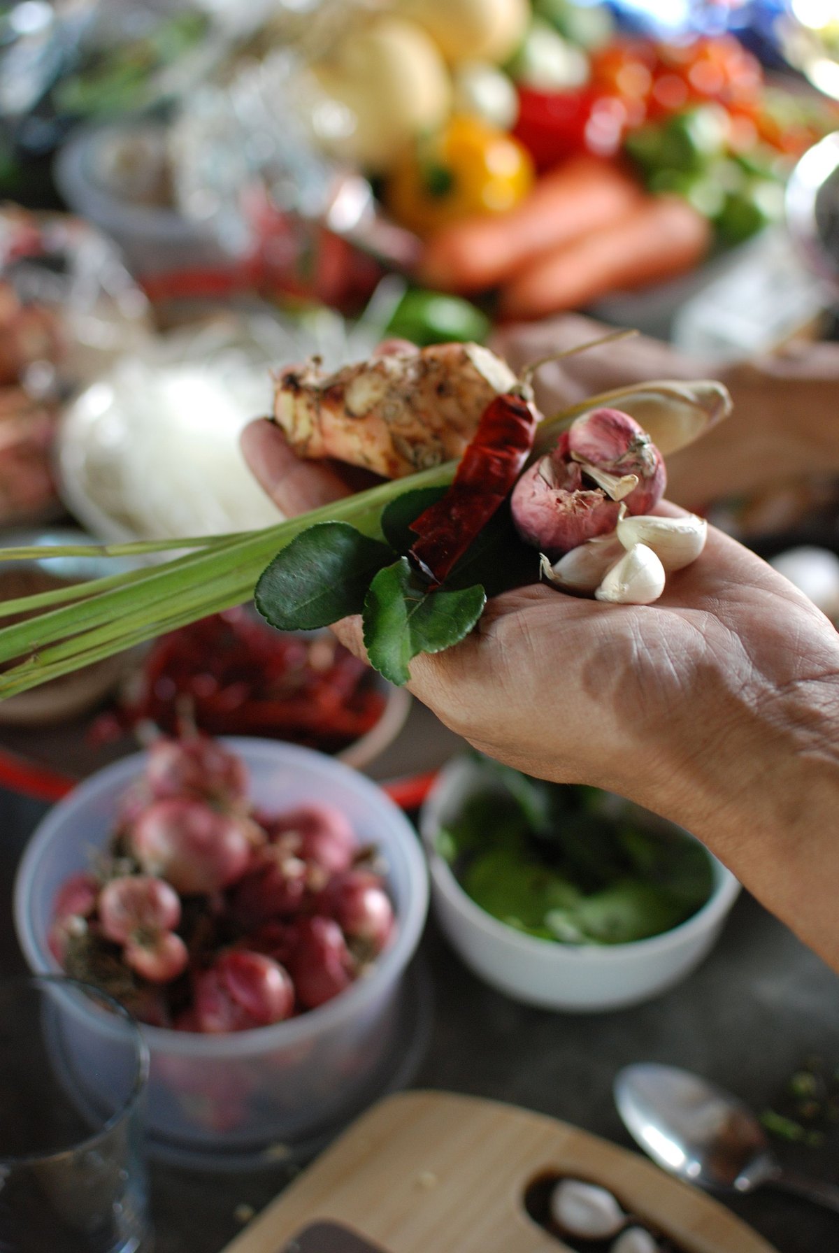 The fresh aromatics gathered before pounding — garlic, shallots, chilies and lemongrass, still whole