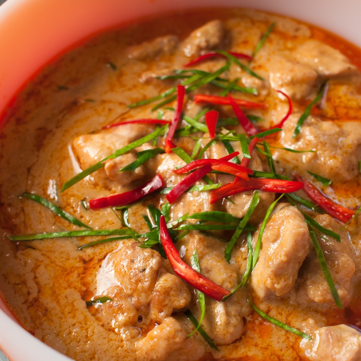 Panang curry — thick, clinging, with shredded makrut lime leaf on top and almost no free sauce