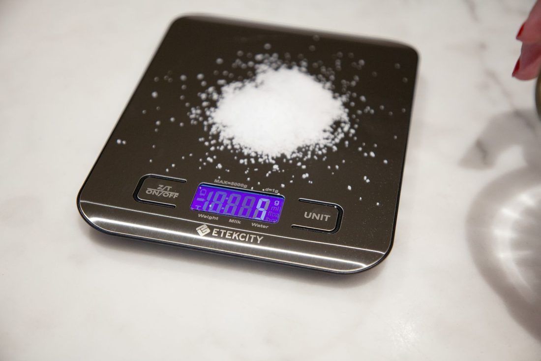 Salt on a digital scale. This is the whole argument of the page: weigh it