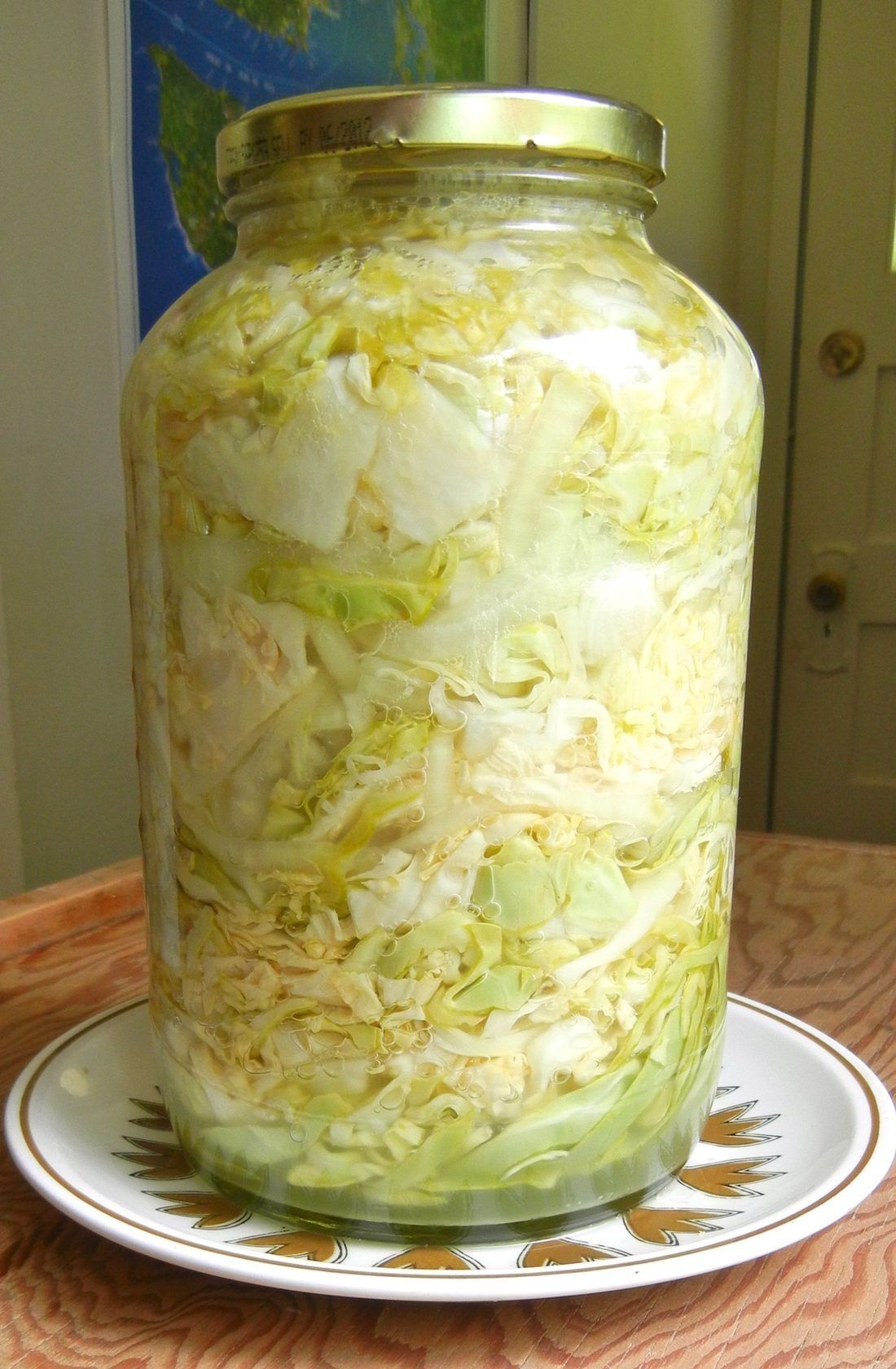 Finished sauerkraut, pale gold and translucent — this batch in a jar rather than a crock
