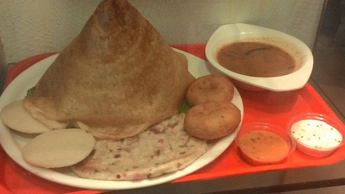 Dosa and idli — both raised and soured by an overnight wild ferment of rice and urad dal, not by yeast