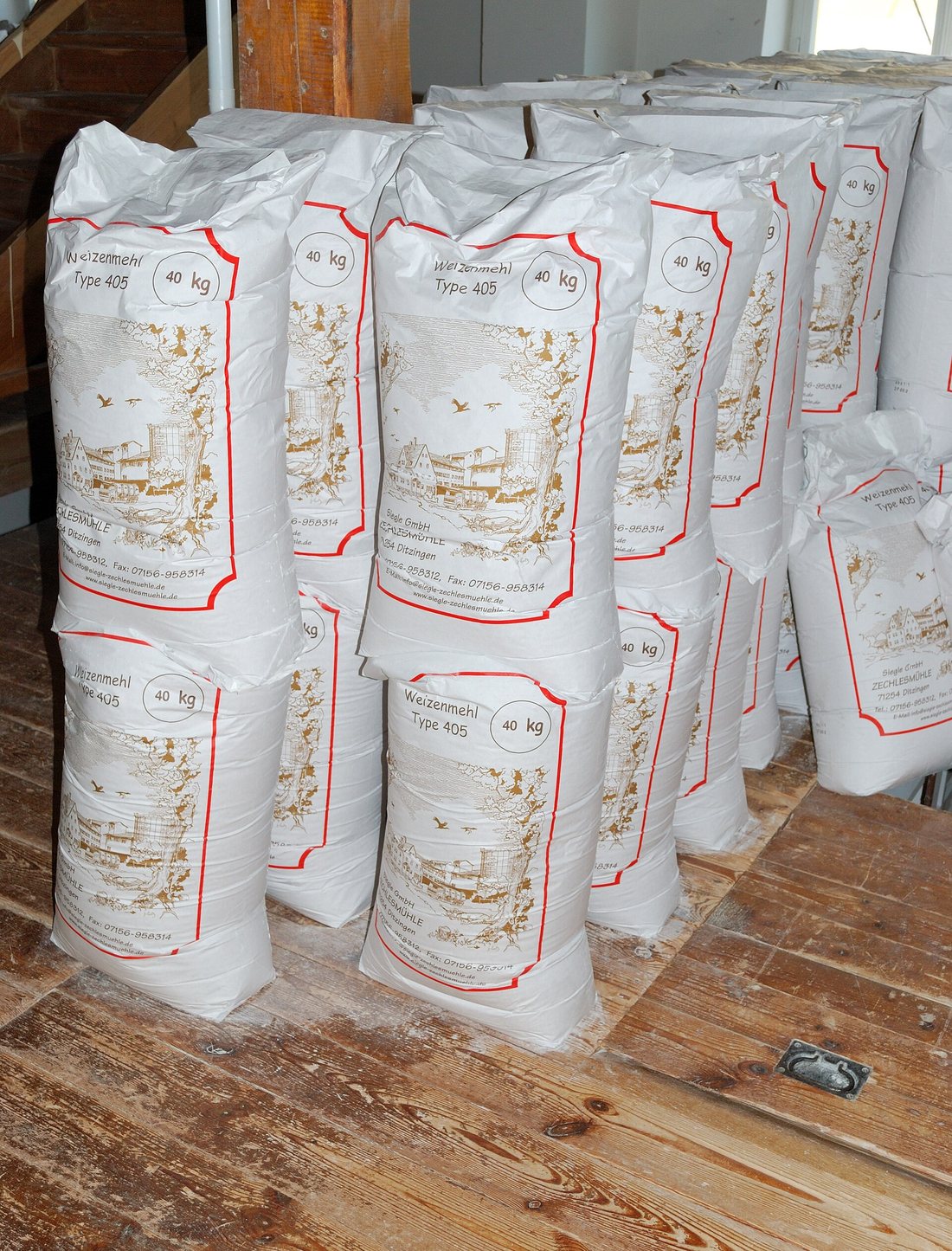 Stacks of 40-kilogram German paper flour sacks printed Weizenmehl Type 405
