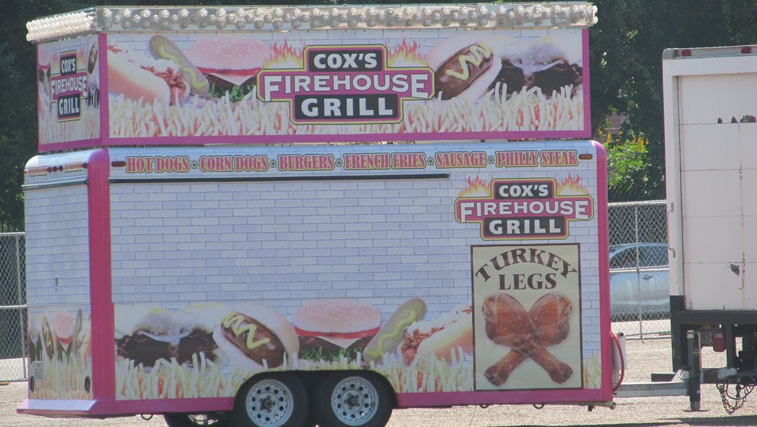 A used step-van food truck and a towable concession trailer parked side by side in a lot