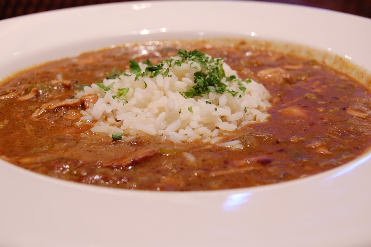 Gumbo ladled over rice, with parsley