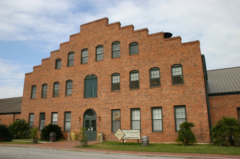 A large brick factory building with a stepped gable, the McIlhenny headquarters at Avery Island