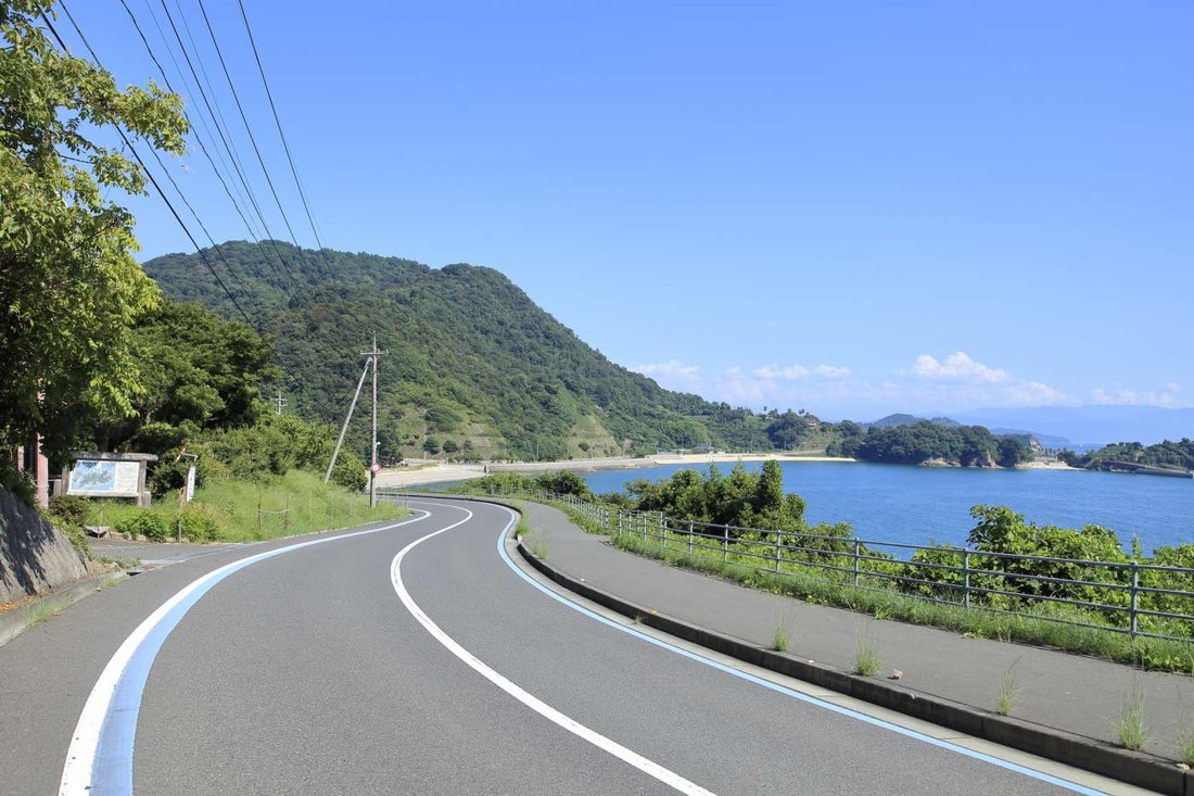 A coastal road in southern Japan. Drive a few hours, then stop — usually at the sea, usually at the docks