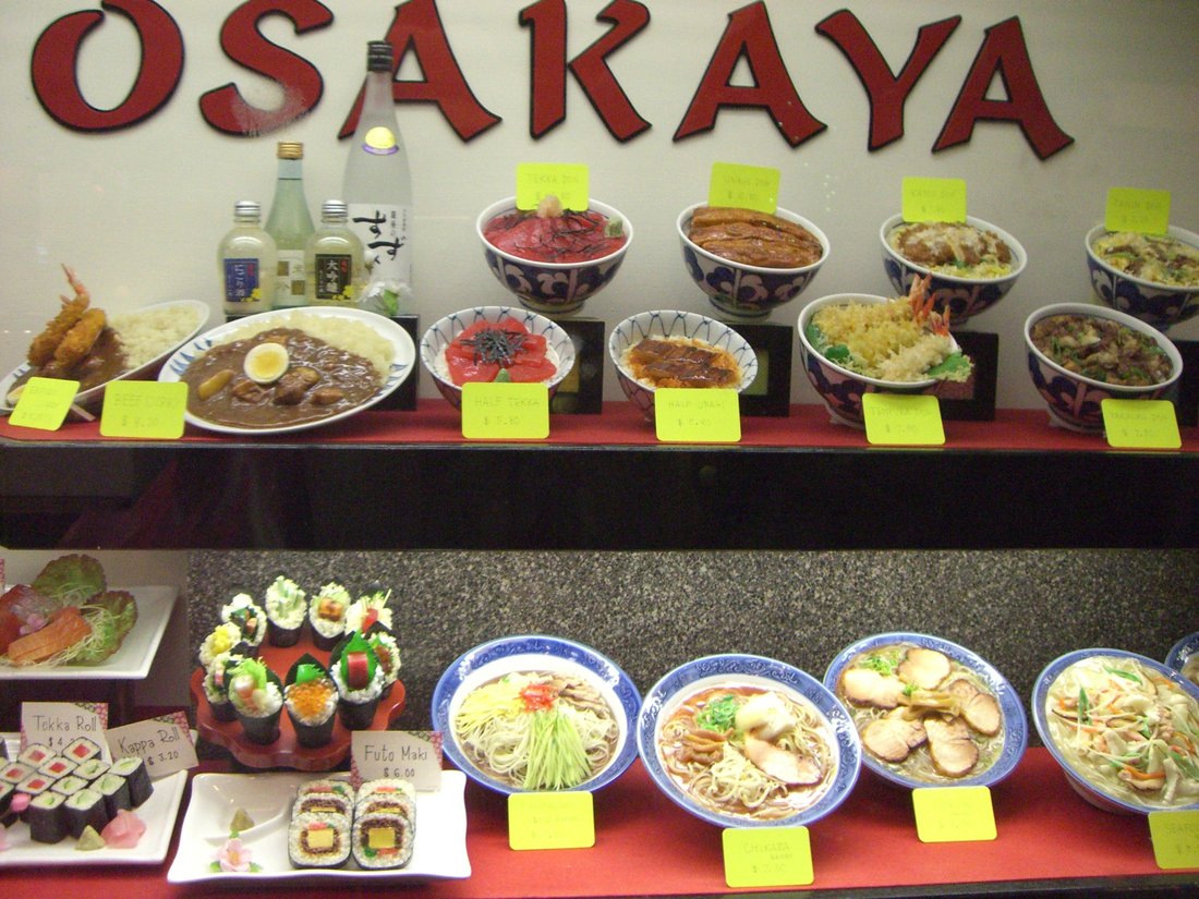 A restaurant window of sampuru — plastic replicas, each hand-made to match a dish on that shop's menu, with the price beside it. This is how I ordered for two years