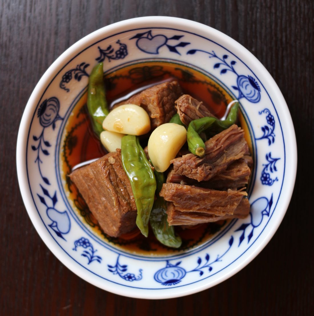 Gyeran jangjorim — eggs and beef braised together in soy, served in a bowl with the braising liquid