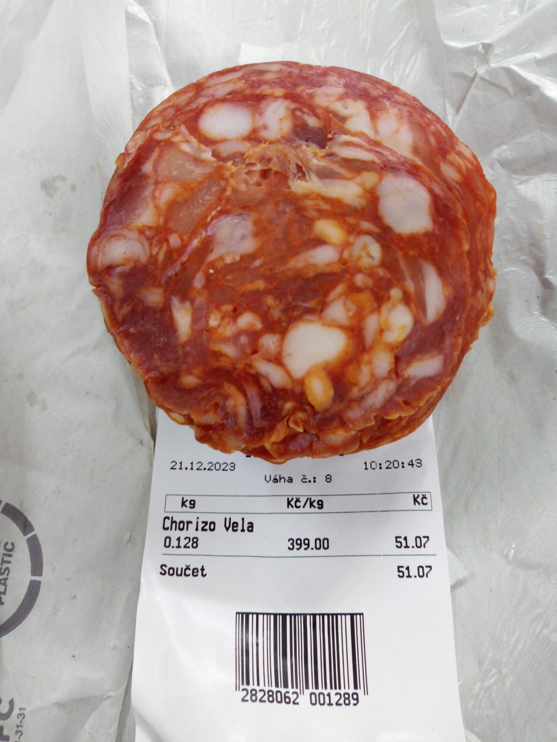 Dry-cured Spanish chorizo, sliced into red coins — firm and sliceable, a different category entirely from fresh Mexican chorizo.