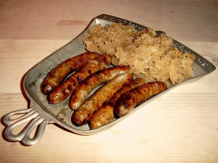 Nürnberger Rostbratwürste — the finger-length Nuremberg sausages whose whole personality is marjoram.