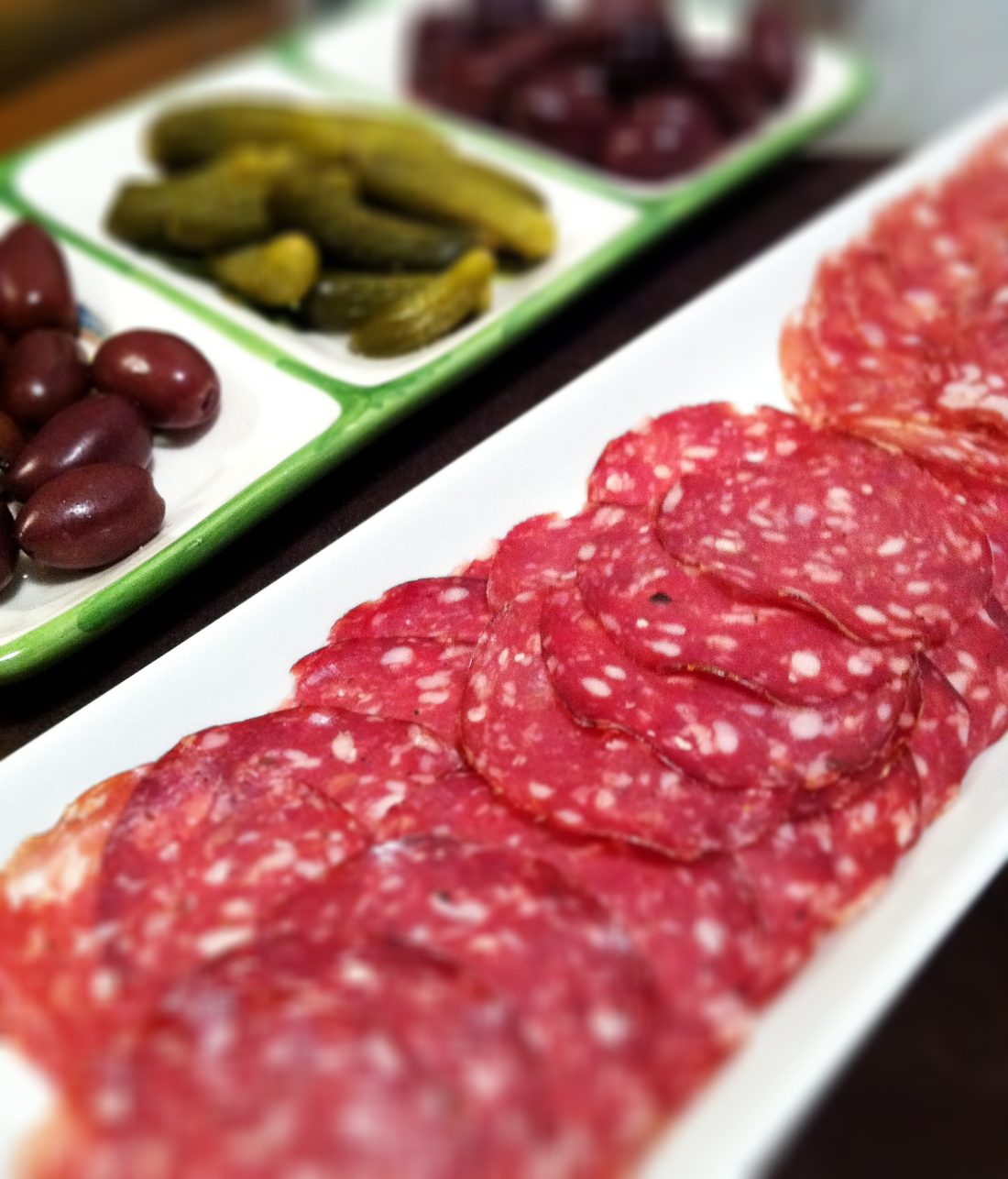 Rosette de Lyon, sliced — a large dry-cured saucisson matured about a month in a beef bung.