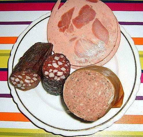 A platter of dark sausages — blood, liver and more, side by side — the branch most Americans never meet at an everyday butcher