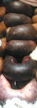 Dark rounds of blood sausage, the set matrix bound by grain and fat rather than by any meat protein