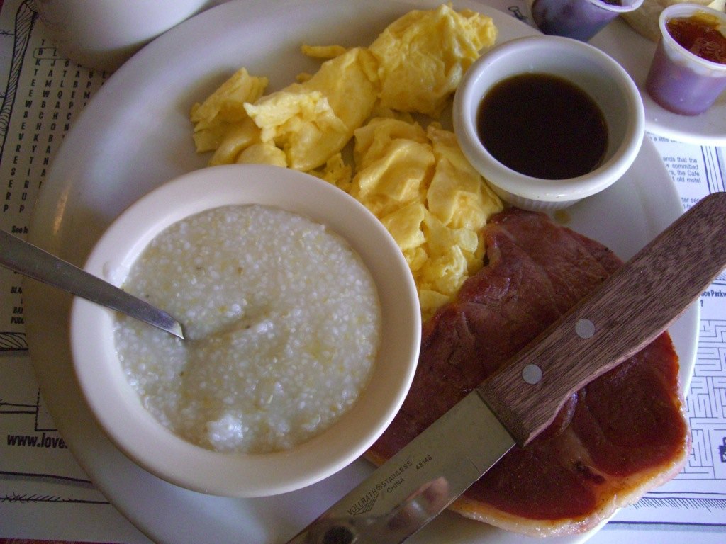 A slice of country ham in a cast-iron skillet