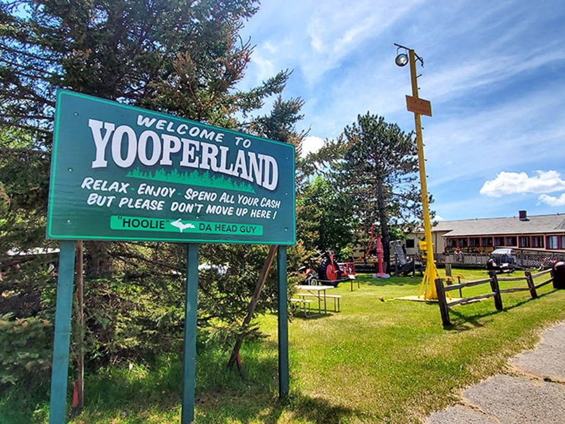 A weathered "State of Superior" or Yooper-pride sign in a small U.P. town